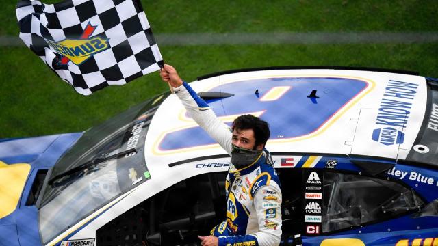 Aug 16, 2020; Daytona Beach, FL, USA; NASCAR Cup Series driver Chase Elliott (9) waves the checkered flag to the fans after winning the Go Bowling 235 Road Course at Daytona International Speedway. Mandatory Credit: Douglas DeFelice-USA TODAY Sports