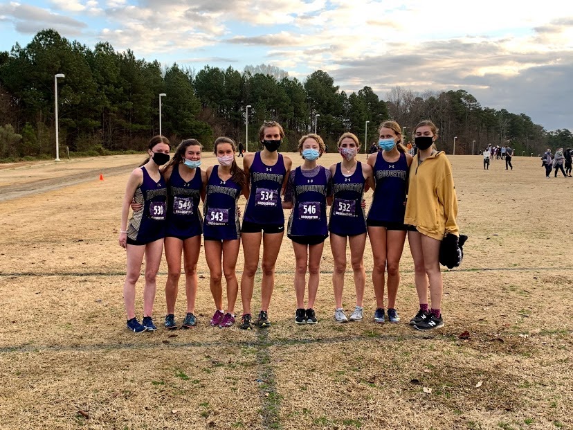 Broughton women’s cross country runners stand together after winning the conference championship. 