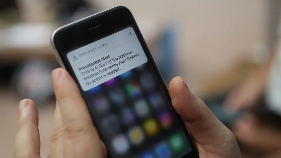 A test of the wireless emergency alert system is displayed on an iPhone